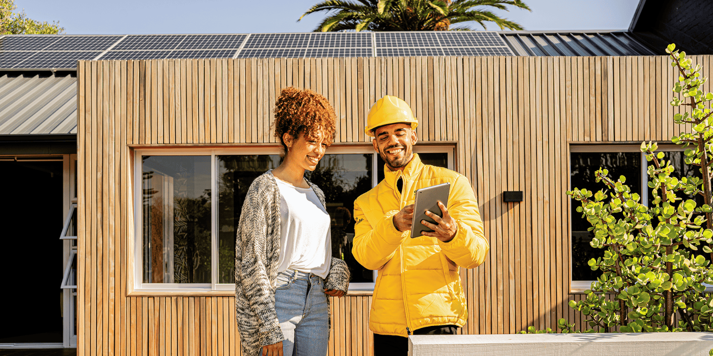 woman and installer outside of house