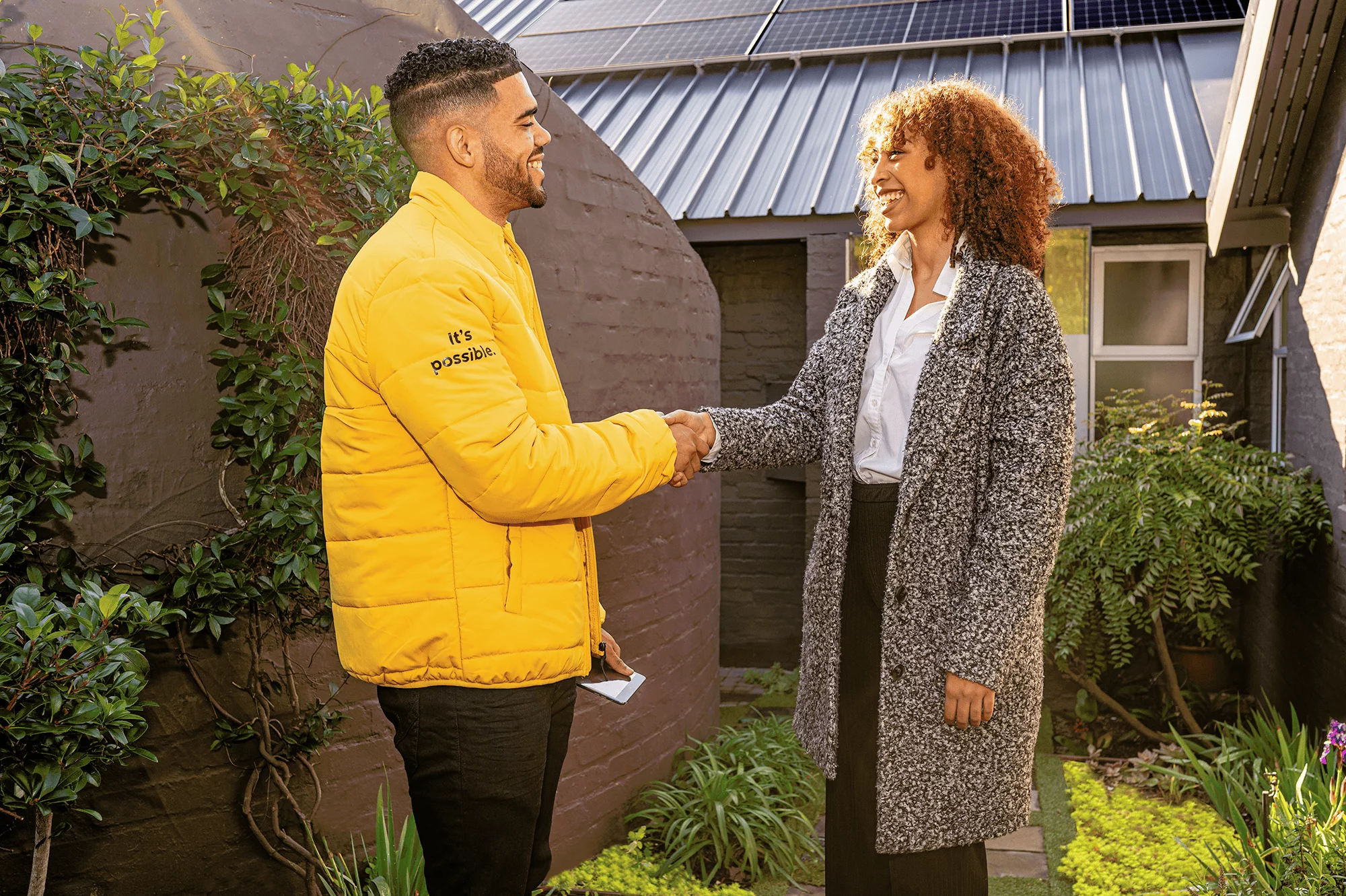 installer and customer shaking hands