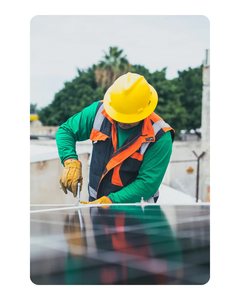 man working on solar panel